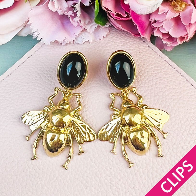 Schwarzer Ohrclips mit vergoldeter Hummel