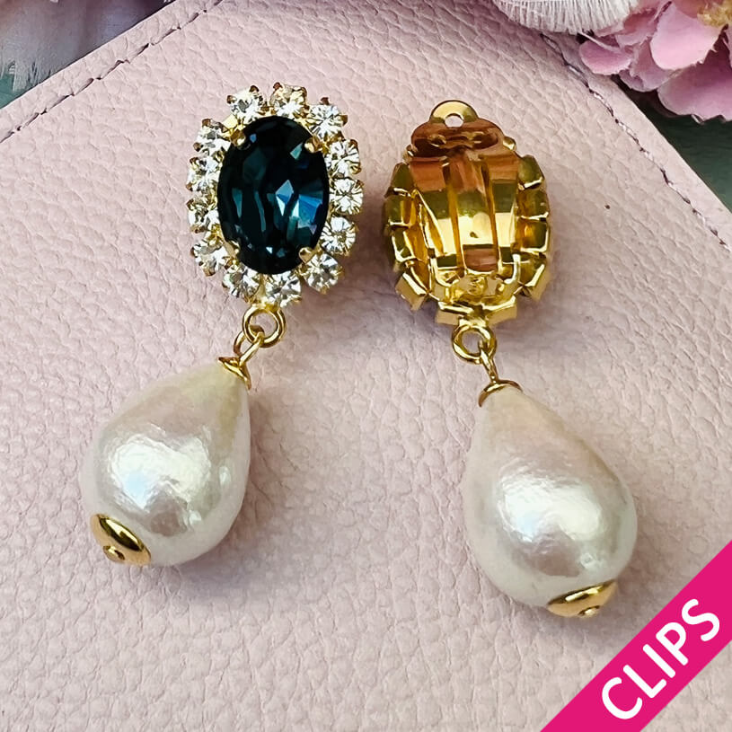 Edel funkelnde Ohrclips in Dunkelblau mit leichtem Baumwolltropfen