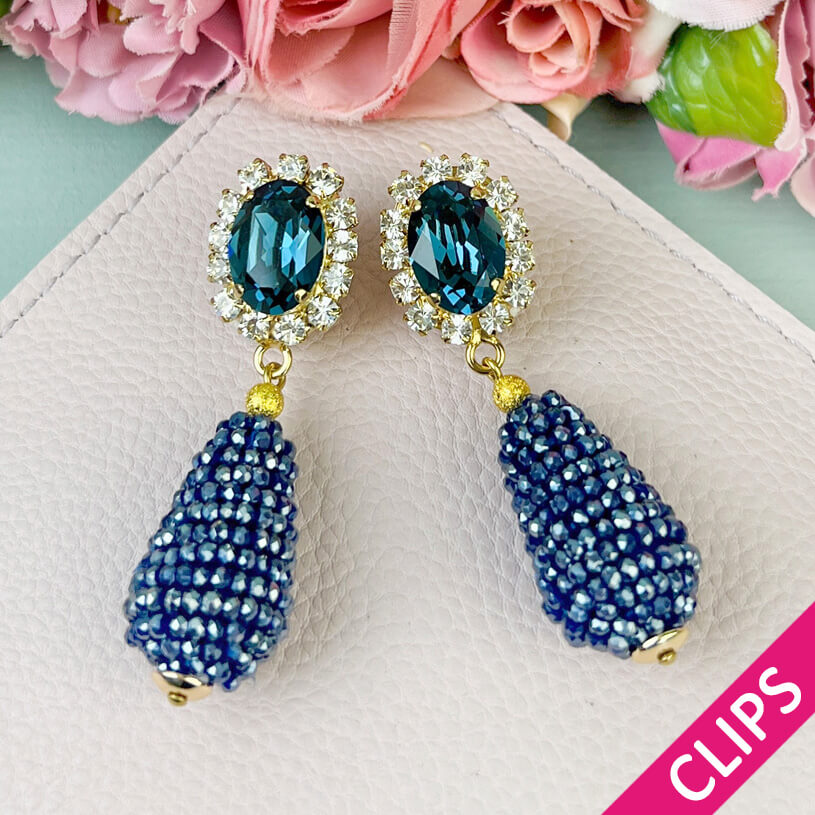 Edel funkelnde Ohrclips in Dunkelblau mit glitzerndem Tropfen