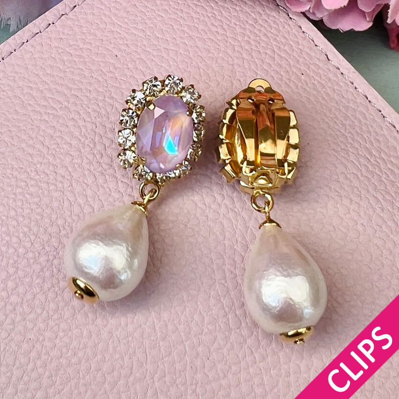 Edel funkelnde Ohrclips in Flieder mit leichtem Baumwolltropfen