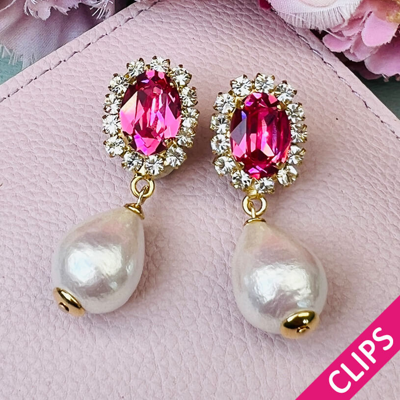 Edel funkelnde Ohrclips in Pink mit leichtem Baumwolltropfen