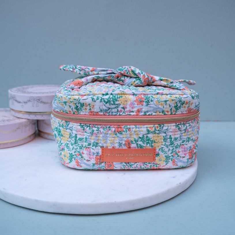 Stoff-Kosmetiktasche mit Schleife mit grün-orangem Blumen-Muster