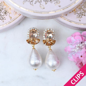 Champagnerfarbene Glas-Kristall-Ohrclips mit Baumwolltropfen