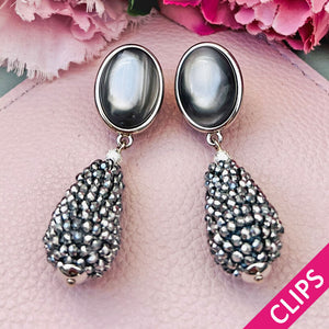 Graue Ohrclips in Silber mit Glitzer-Tropfen