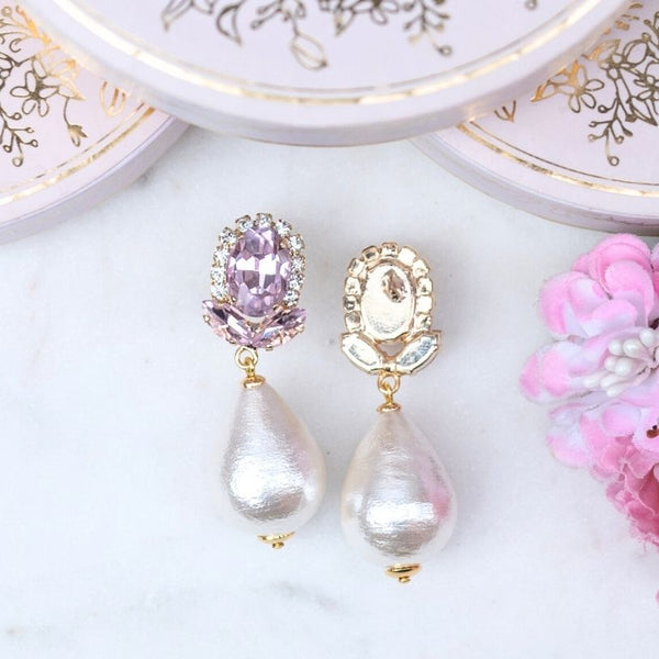 Rosafarbene Glas-Kristall-Ohrstecker mit Baumwolltropfen