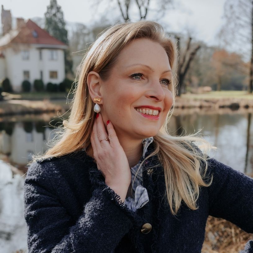 Elegante Schleifenohrclips mit leichtem Baumwolltropfen