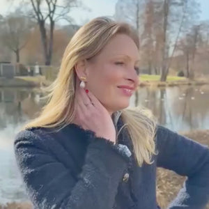 Elegante Schleifenohrringe mit leichtem Baumwolltropfen