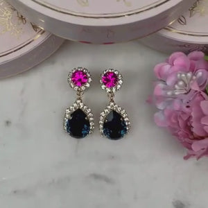 Pinke Glas-Kristall-Ohrstecker mit dunkelblauem Kristalltropfen